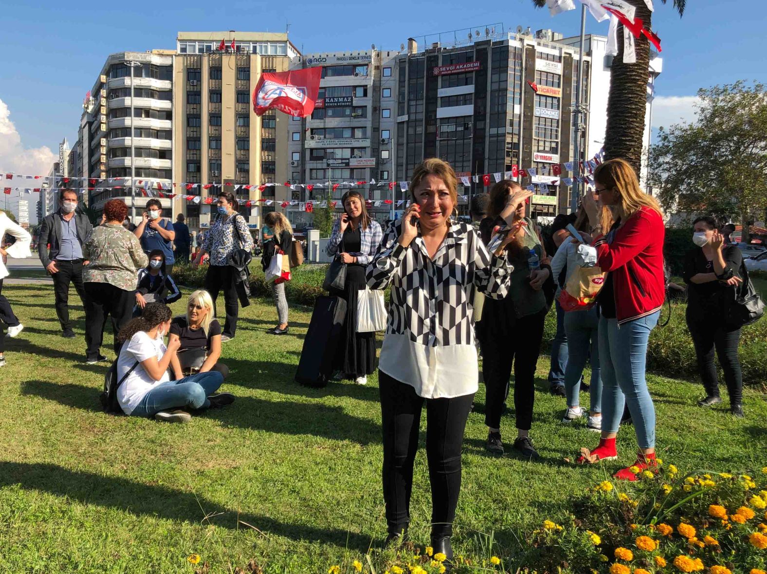 People in Izmir take refuge outdoors after the earthquake.