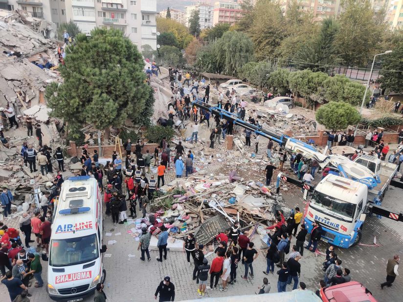 Search and rescue operations take place at a building in Izmir.