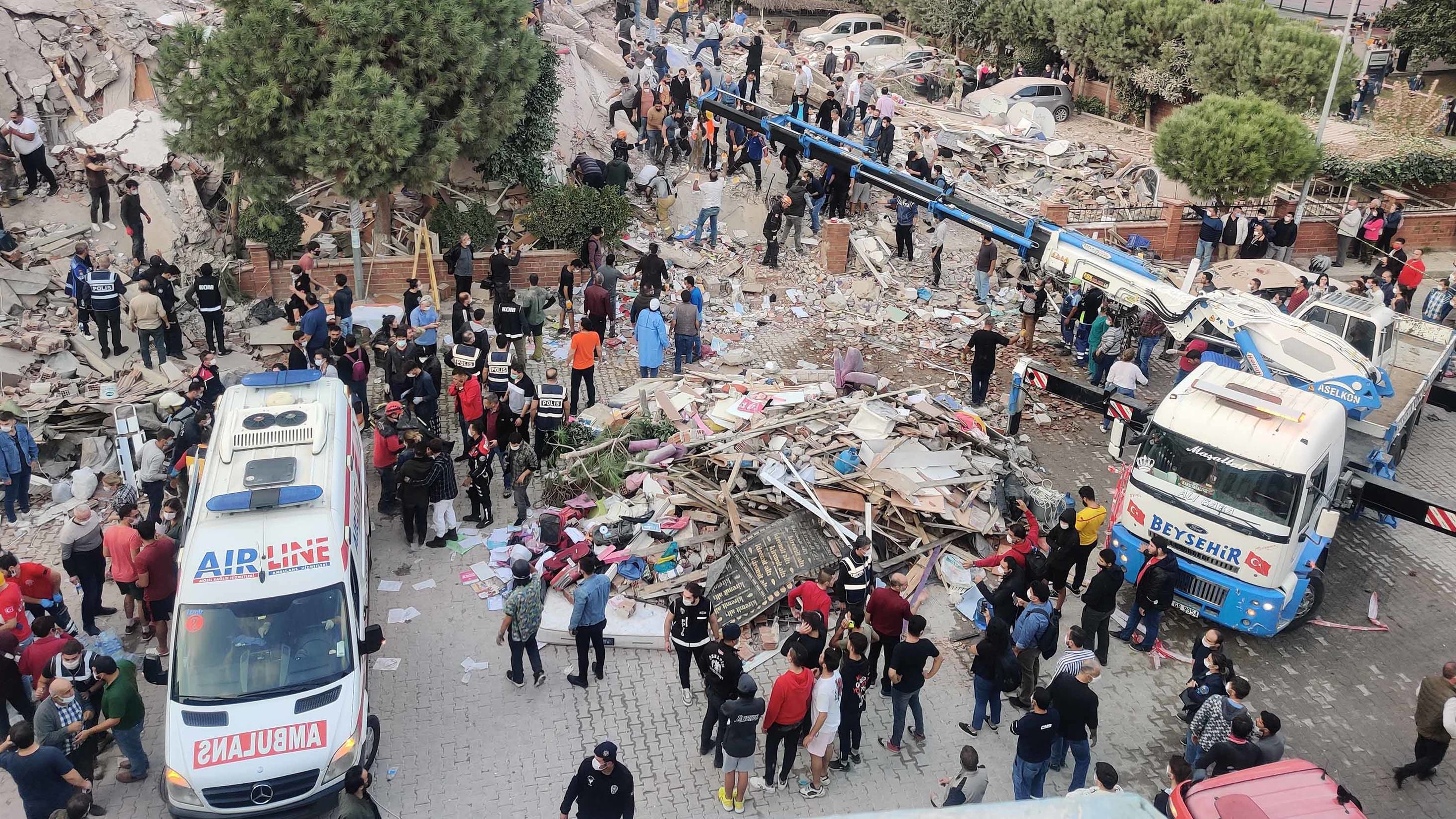 Search and rescue operations take place at a building in Izmir.