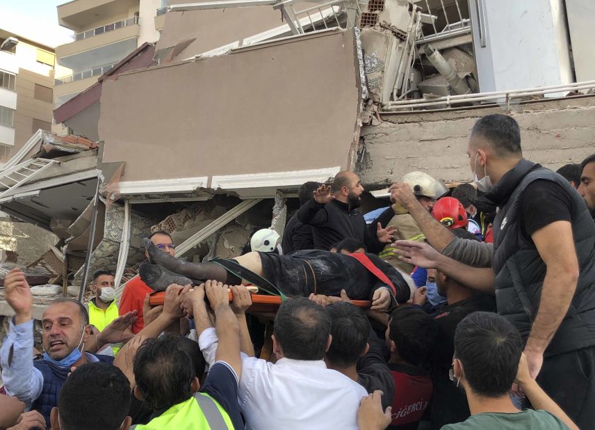 A wounded person is rescued from a collapsed building in Izmir.