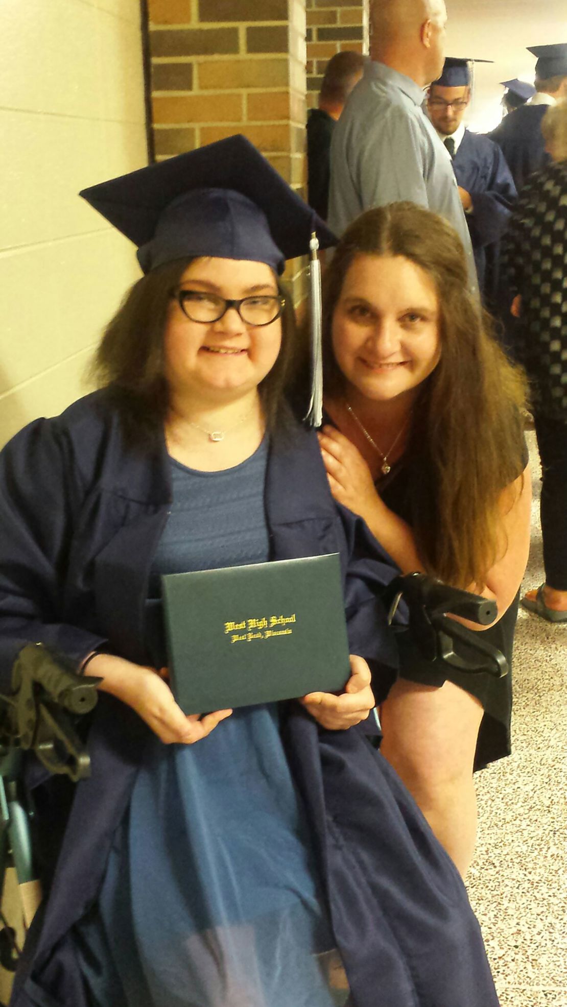 Amber Pflughoeft on the day of her high school graduation with her mother, Tiffany Pflughoeft.