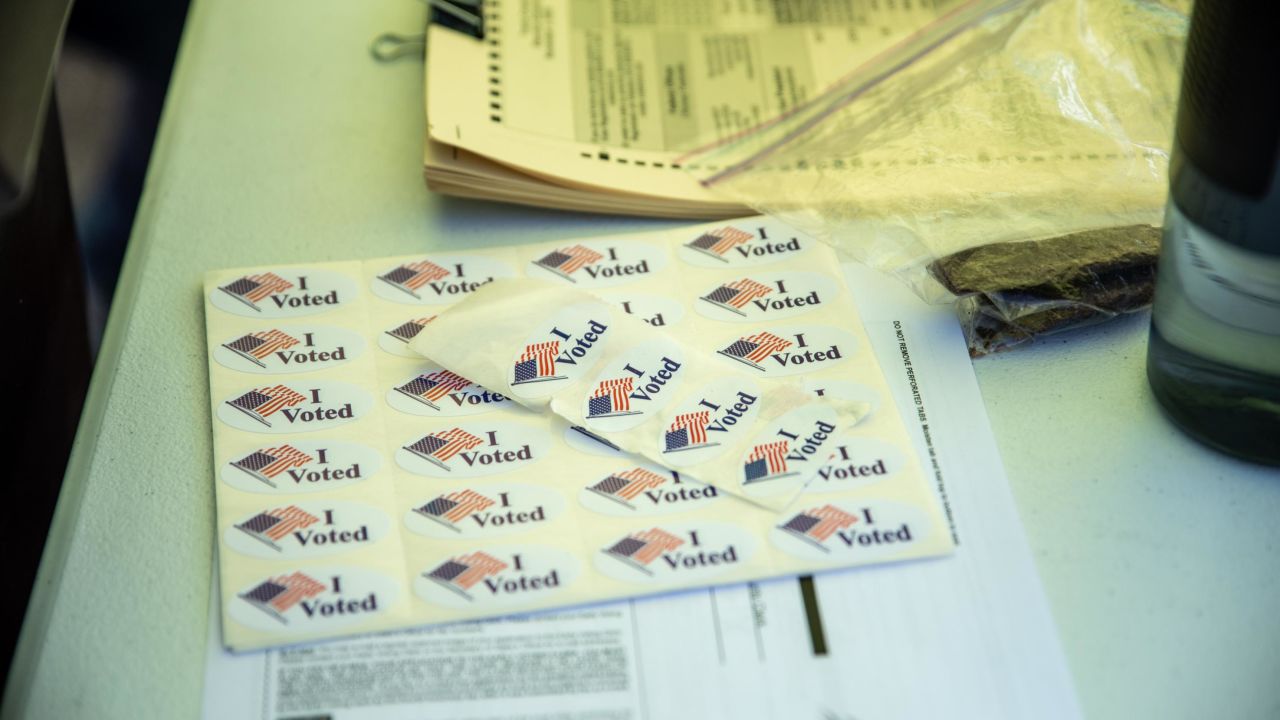 "I voted" stickers and other forms line a table at a ballot drop off location on October 13, 2020 in Austin, Texas. 