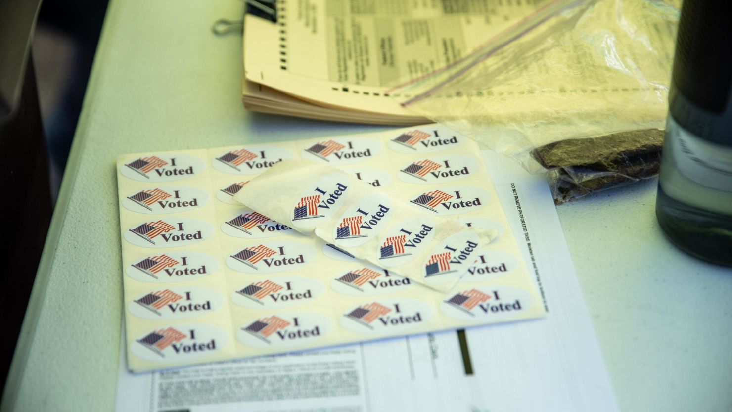 "I voted" stickers and other forms line a table at a ballot drop off location on October 13, 2020 in Austin, Texas. 