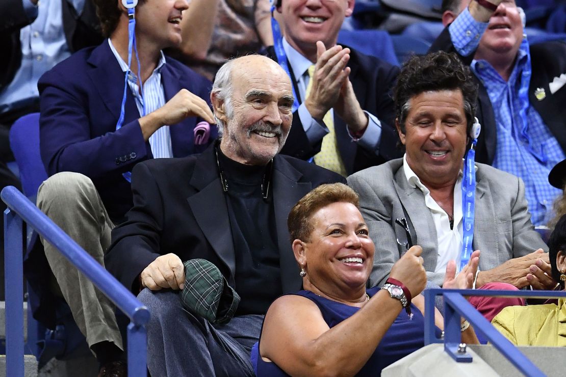 Connery, center, watches a 2017 US Open Men's Singles match in New York on August 29, 2017.