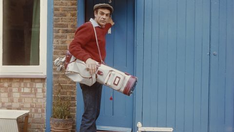 Connery sets off for a game of golf in August 1962.