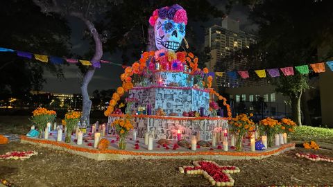 The community altar at Muertos Fest in San Antonio is filled with photo submissions from locals.