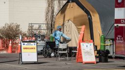 EL PASO, TX - OCTOBER 30: A nurse enters a tent for coronavirus patients setup at University Medical Center on October 30, 2020 in El Paso, Texas. As coronavirus cases surge in El Paso, overwhelmed hospitals have expanded their capacity to treat patients by erecting temporary tents. (Photo by Cengiz Yar/Getty Images)