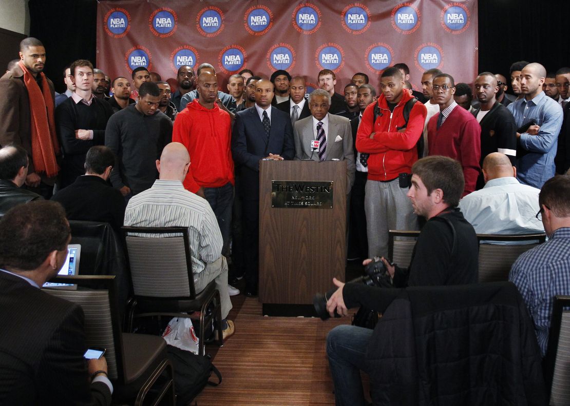 Members of the NBA players association look on as Executive Director of the National Basketball Players Association Billy Hunter (C) speaks during a news conference announcing the players rejection of the league's latest offer on Monday and the process to begin disbanding the union in New York November 14, 2011. REUTERS/Shannon Stapleton (UNITED STATES - Tags: SPORT BASKETBALL BUSINESS EMPLOYMENT)