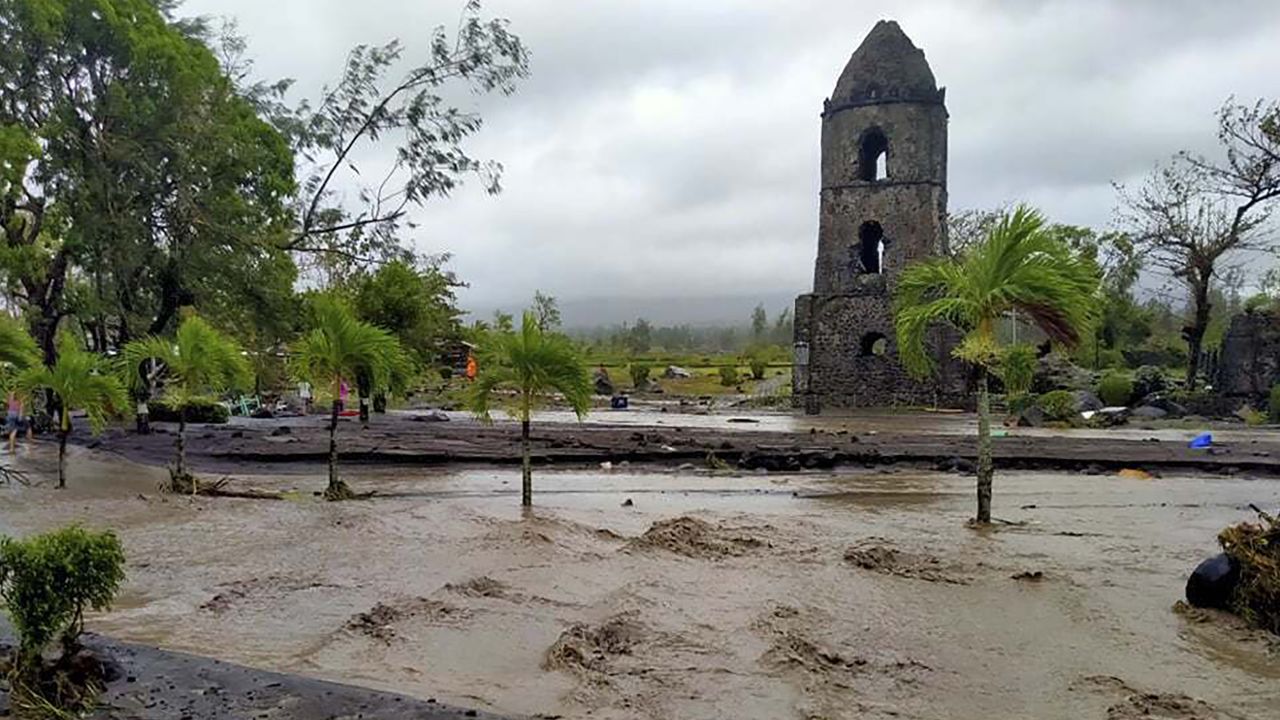 Floodwaters pass by Cagsawa ruins, a famous tourist spot in Daraga, Albay province, central Philippines as Typhoon Goni hit the area Sunday, November 1.