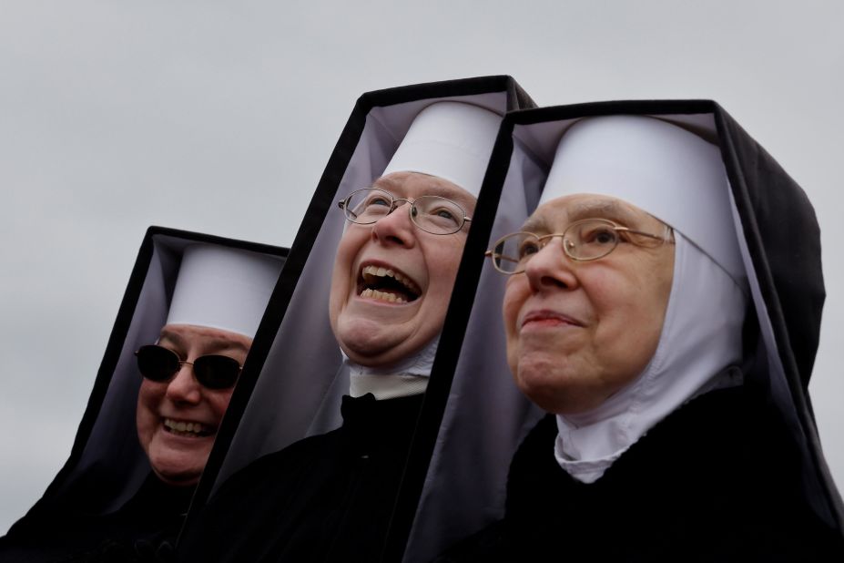 Nuns react as Trump campaigns in Waterford Township on October 30.
