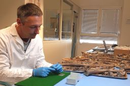 Co-senior study author Stefano Benazzi, a professor at the University of Bologna, is shown here studying Neanderthal remains. 