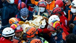 In this handout photo made available by the Istanbul Fire Authority, members of various rescue services carry 3-year-old girl Elif Perincek, after she was rescued from the rubble of a building some 65 hours after a magnitude 6.6 earthquake in Izmir, Turkey, Monday, Nov. 2, 2020. Rescue teams continue ploughing through concrete blocs and debris of collapsed buildings in Turkey's third largest city in search of survivors of a powerful earthquake that struck Turkey's Aegean coast and north of the Greek island of Samos, Friday Oct. 30, killing dozens. Close to a thousand people were injured.(Istanbul Fire Authority via AP)