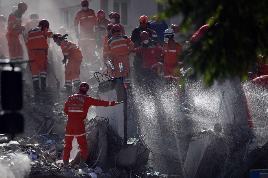 Crews work at the site of a collapsed building in Izmir.