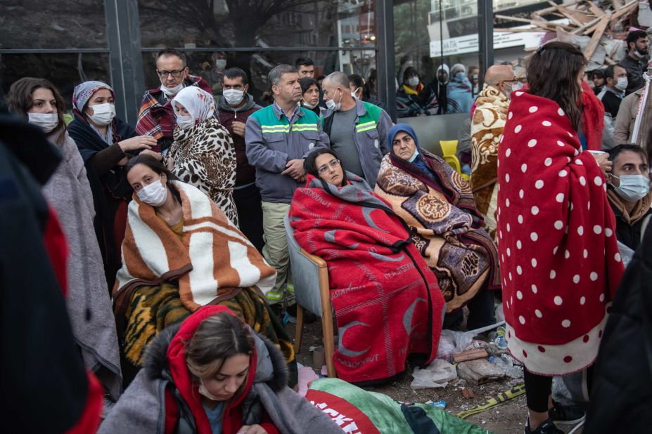 Survivors in Izmir wait for news of their loved ones, believed to be trapped under collapsed buildings, on Sunday, November 1. 