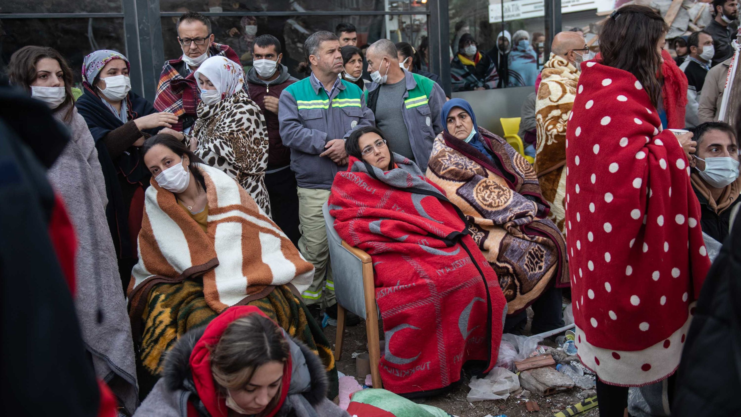 Survivors in Izmir wait for news of their loved ones, believed to be trapped under collapsed buildings, on Sunday, November 1. 