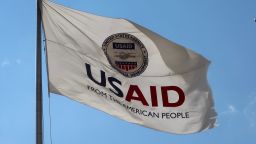 WASHINGTON - AUGUST 2, 2020: US AID Agency for International Development flag with emblem seal outside headquarters building