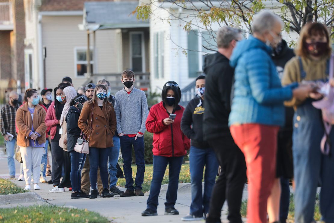 Voters wait in line to cast ballots in the presidential election on November 2, 2020 in Cedar Rapids, Iowa. 