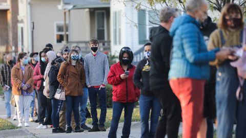 Voters wait in line to cast ballots in the presidential election on November 2, 2020 in Cedar Rapids, Iowa. 