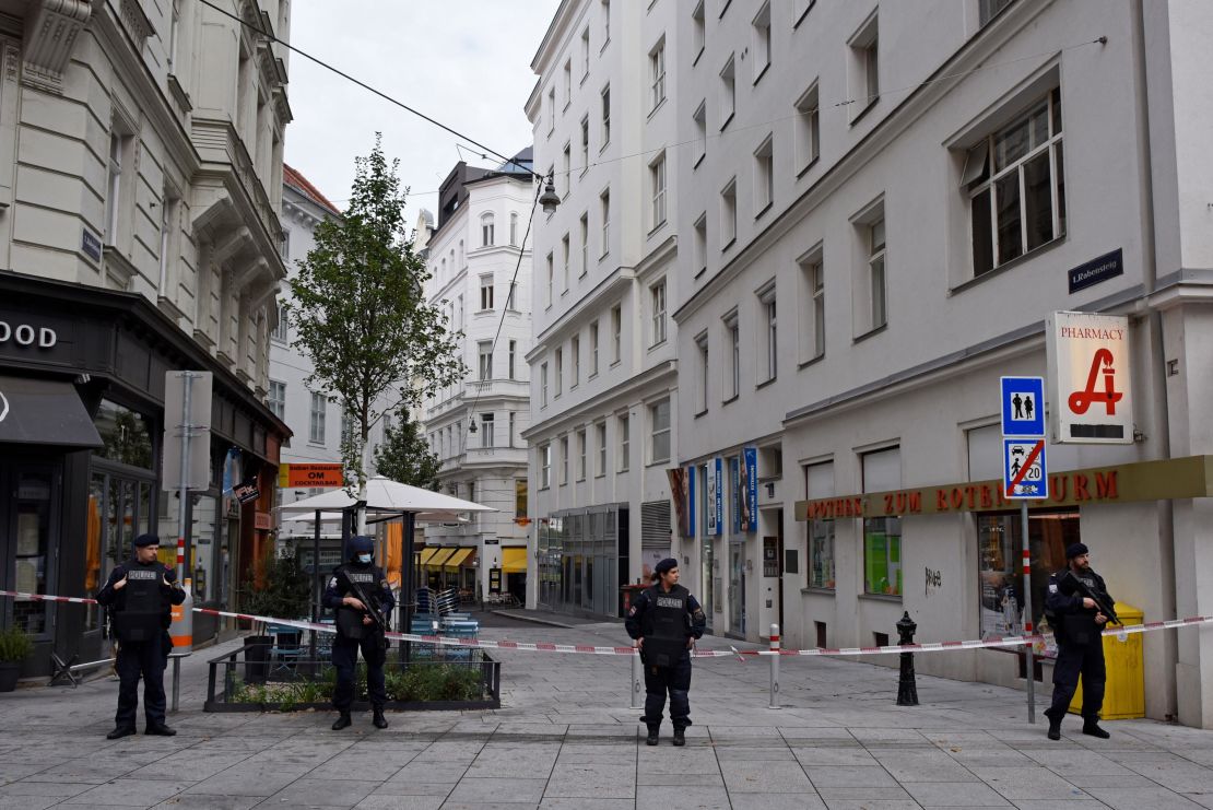 Police stand guard in Vienna's city center Tuesday, a day after the gun attack.