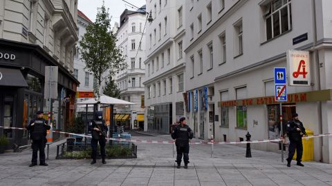 Police stand guard in Vienna's city center Tuesday, a day after the gun attack.