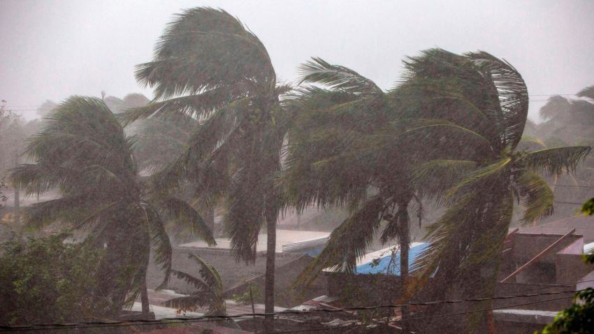 Palm trees blow in the wind as Hurricane Eta makes landfall in Bilwi, Puerto Cabezas, Nicaragua, on November 3, 2020. - A powerful Hurricane Eta lashed the north coast of Nicaragua on Tuesday with heavy rain and winds of more than 130 miles per hour that ripped up trees and roofs, authorities said. (Photo by INTI OCON / AFP) (Photo by INTI OCON/AFP via Getty Images)