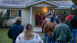 Voters stand in line at dawn as the polls open on November 3, 2020, in Crawfordville, Florida.