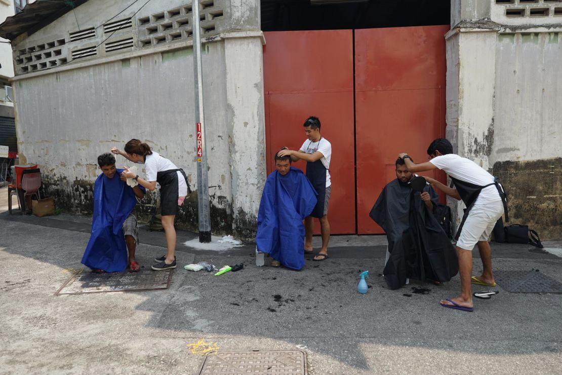 Geylang Adventures founder Yinzhou launched Backalleybarbers in 2014, offering free haircuts on the streets of Geylang.