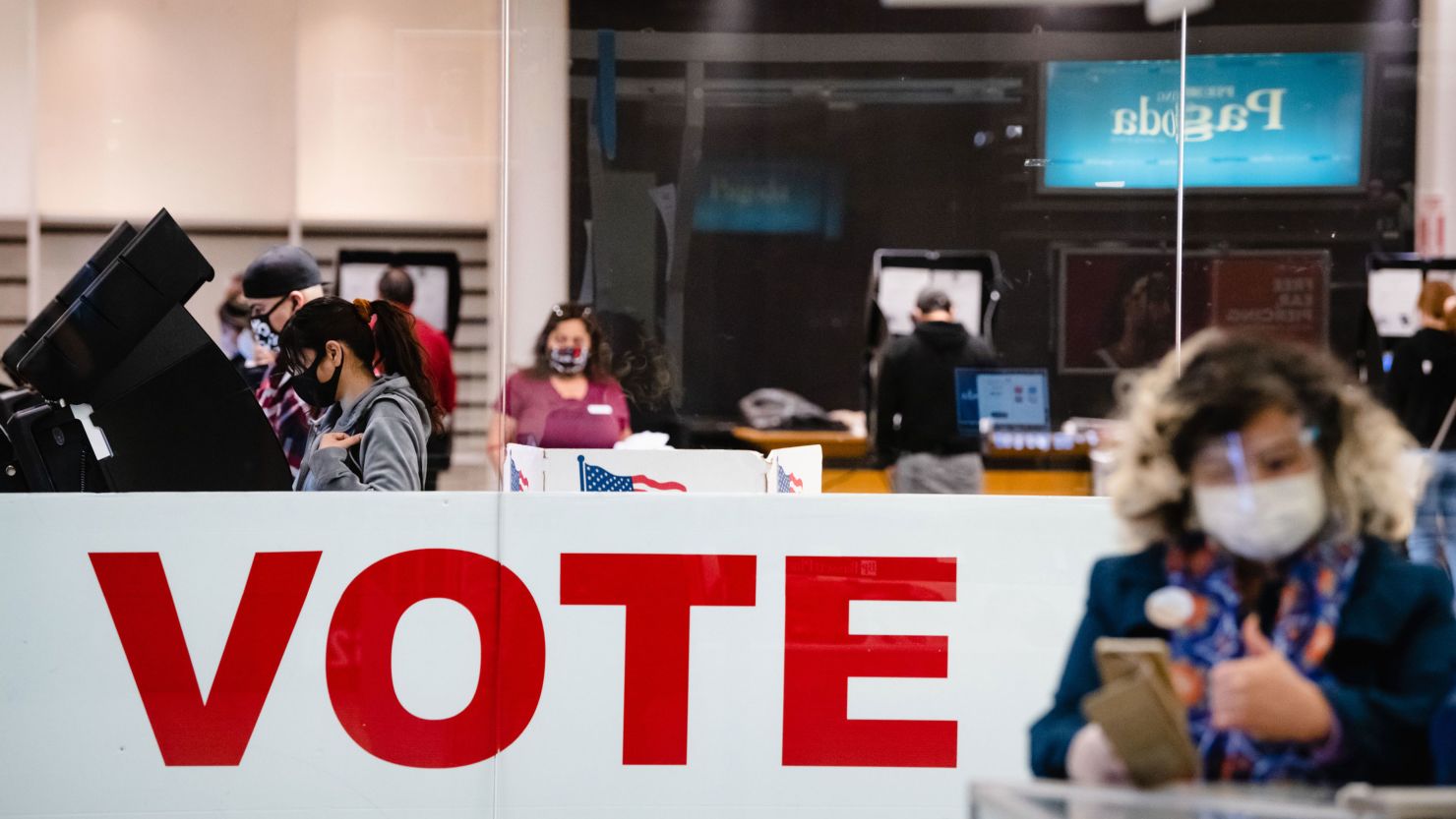 A woman votes in the general election at the Basset Place Mall in El Paso, Texas, on November 3, 2020.