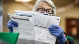 Election judge Bonnie Carr of Denver, Colorado pours over a ballot as she prepares them to be counted at the Denver Elections Division Building on November 3, 2020 in Denver, Colorado. After a record-breaking early voting turnout, Americans head to the polls on the last day to cast their vote for incumbent U.S. President Donald Trump or Democratic nominee Joe Biden in the 2020 presidential election. 