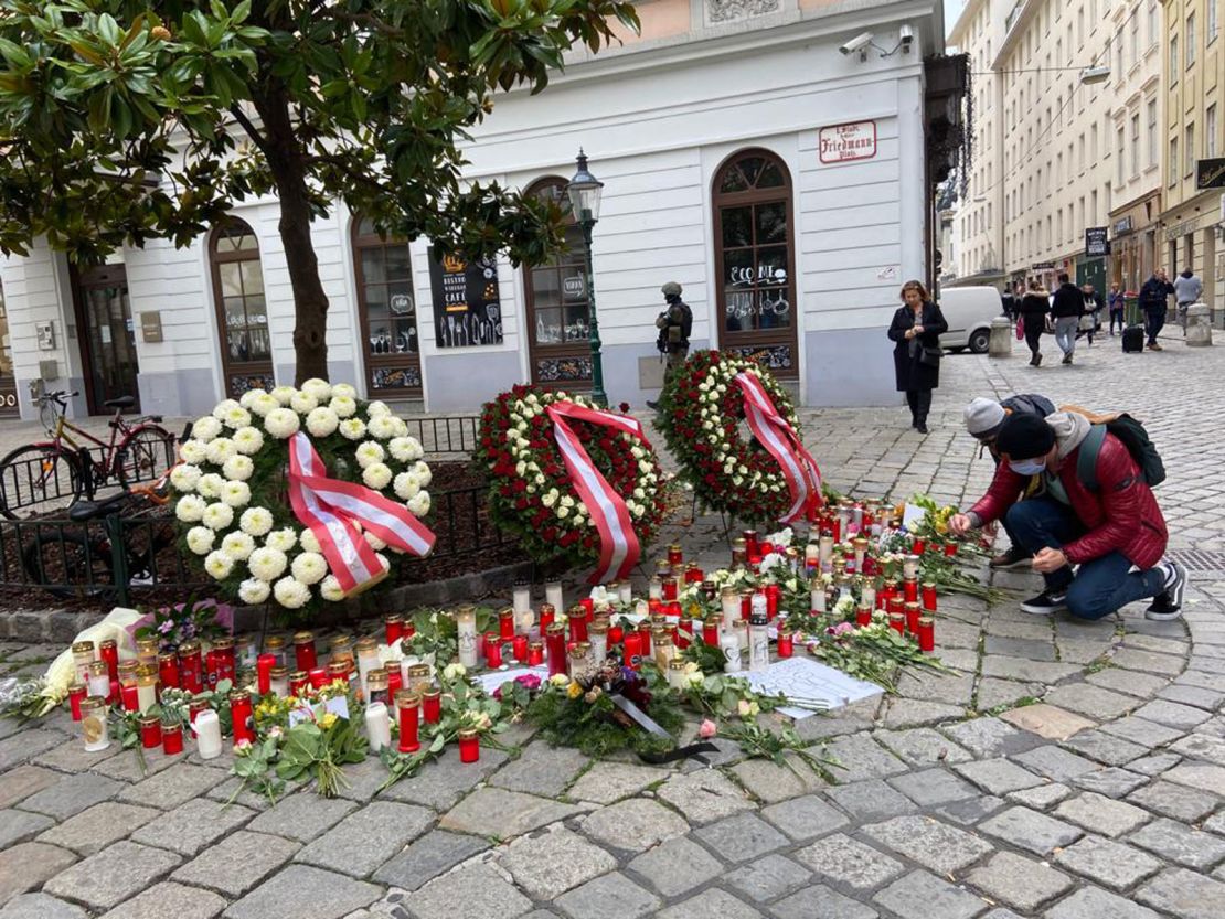 Wreaths, flowers and candles are left on Judengasse in Vienna on Wednesday.