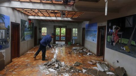 A resident removes debris after Hurricane Eta struck Puerto Cabezas, Nicaragua, on Tuesday.