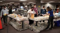 MILWAUKEE, WISCONSIN - NOVEMBER 04: Election officials count absentee ballots on November 04, 2020 in Milwaukee, Wisconsin. Wisconsin requires election officials to wait to begin counting absentee ballots until after polls open on election day. The Milwaukee count was finished about 3AM.  (Photo by Scott Olson/Getty Images)