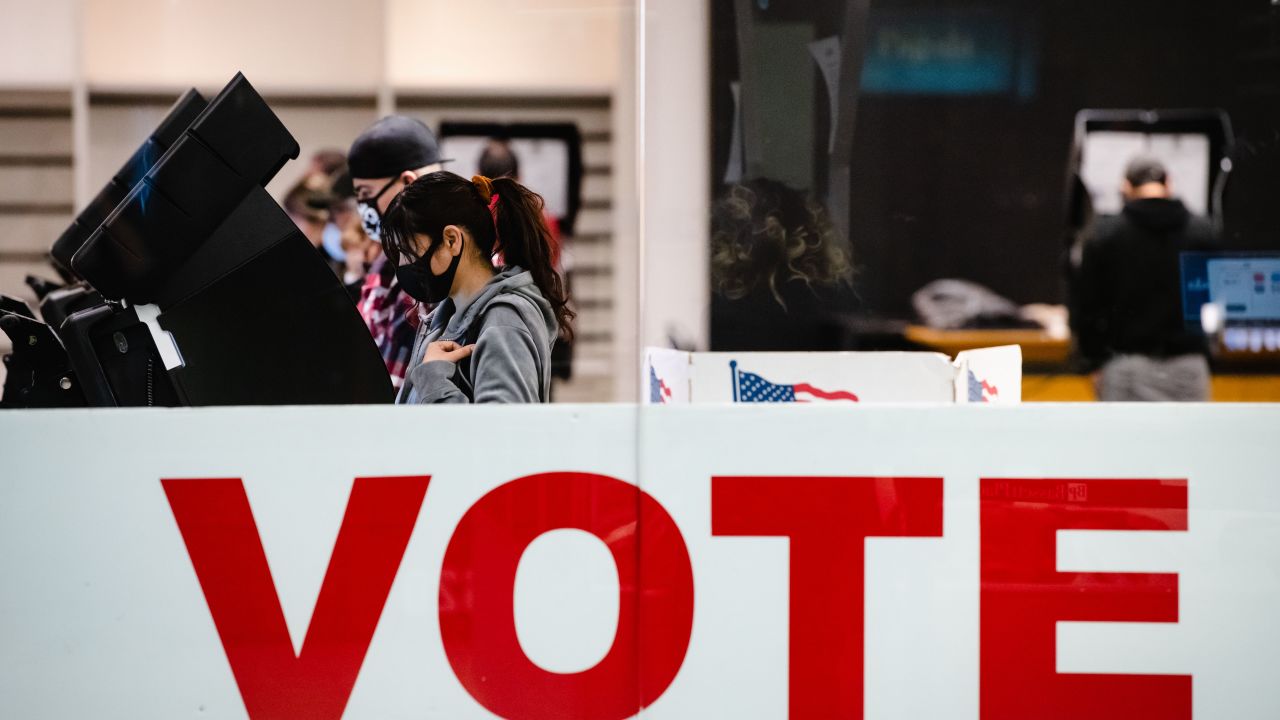 A woman casts her ballot in the 2020 general election inside the Basset Place Mall in El Paso, Texas on November 3, 2020.