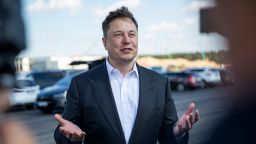 Tesla head Elon Musk talks to the press as he arrives to to have a look at the construction site of the new Tesla Gigafactory near Berlin on September 03, 2020 near Gruenheide, Germany. Musk is currently in Germany where he met with vaccine maker CureVac on Tuesday, with which Tesla has a cooperation to build devices for producing RNA vaccines, as well as German Economy Minister Peter Altmaier yesterday. (Photo by Maja Hitij/Getty Images)