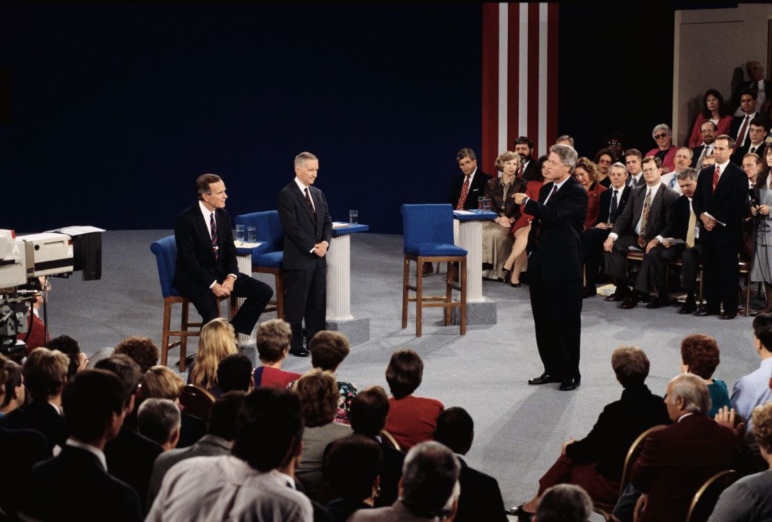 President George H.W. Bush and Ross Perot listen to presidential candidate Bill Clinton speak during a presidential debate in 1992. 