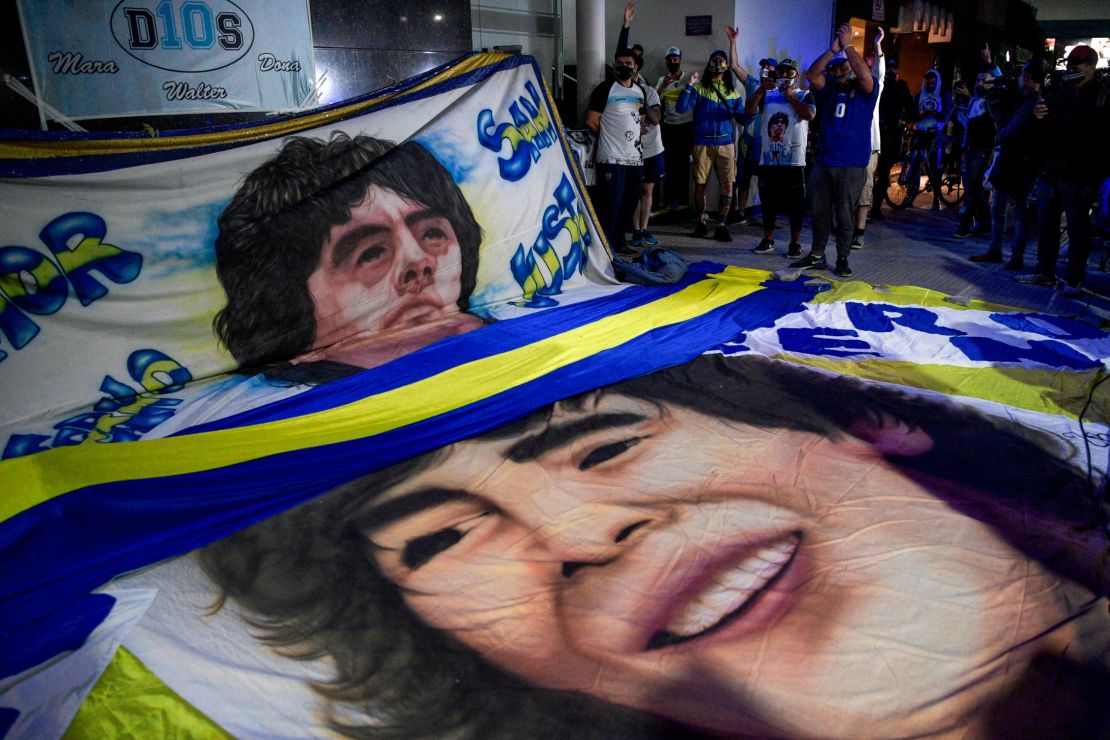 Maradona fans gather outside the hospital where he underwent brain surgery for a blood clot.