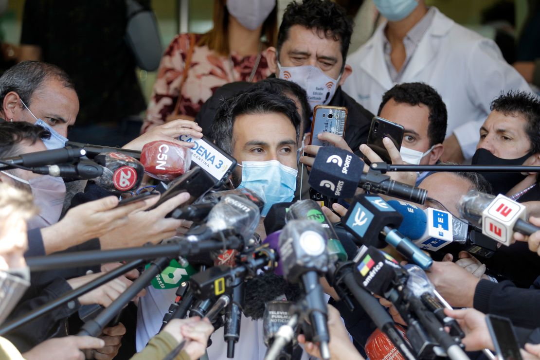 Leopoldo Luque, Diego Maradona's  personal physician, gives a medical report outside the clinic.