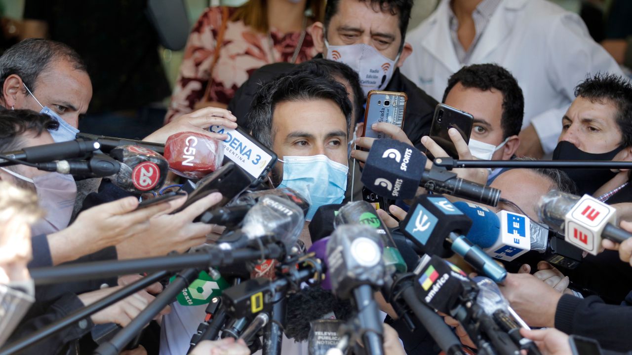 Leopoldo Luque, Diego Maradona's personal physician, gives a medical report outside the clinic.