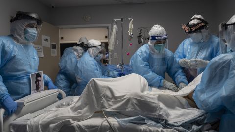 Medical staff members treat a patient suffering from Covid-19 in the Covid-19 intensive care unit at the United Memorial Medical Center on October 31, 2020 in Houston, Texas.