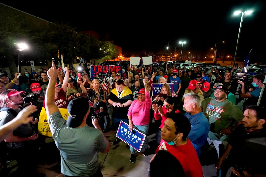 President Donald Trump's supporters rally on Wednesday night outside the Maricopa County vote counting center in Phoenix.