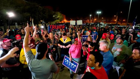 President Donald Trump's supporters rally on Wednesday night outside the Maricopa County vote counting center in Phoenix.