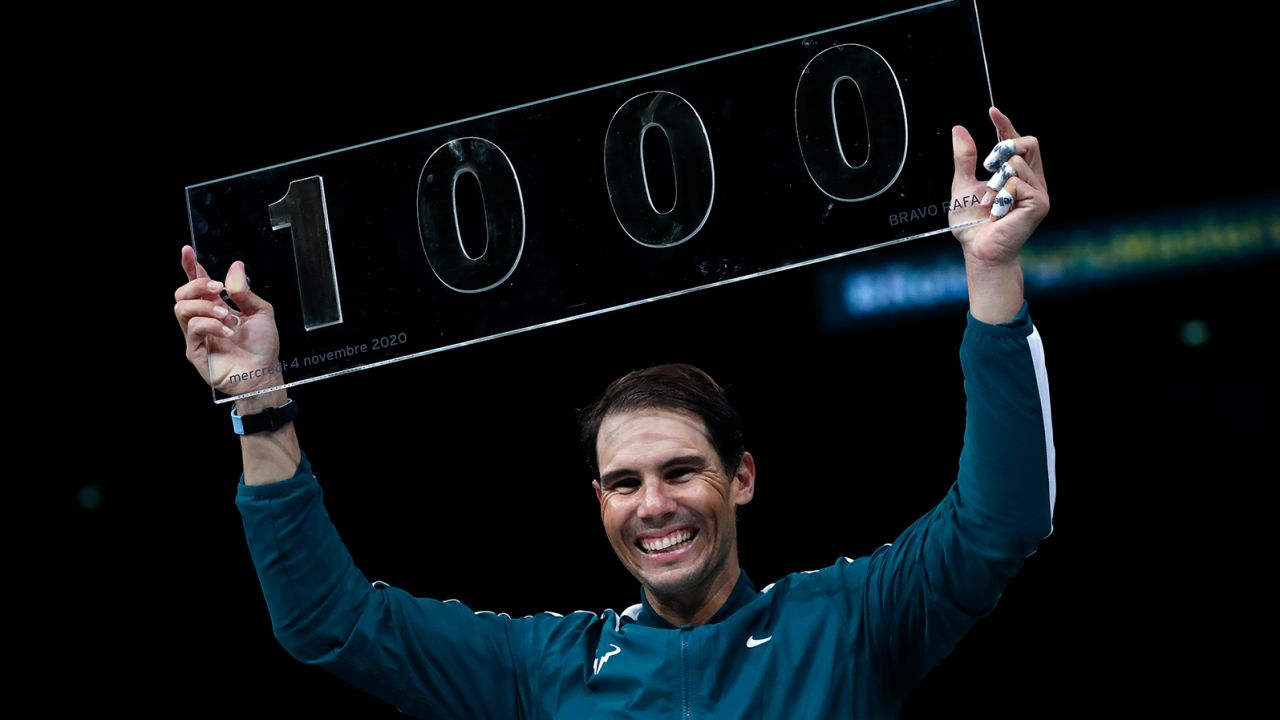Nadal poses with the trophy of his 1000th victory.