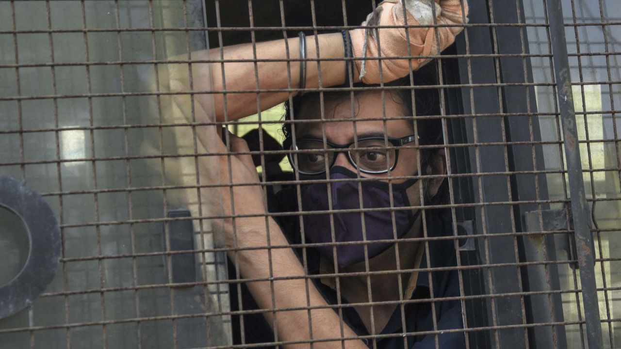 Indian television news anchor Arnab Goswami sits inside a police vehicle after he was taken to court following his arrest in Mumbai on November 4.