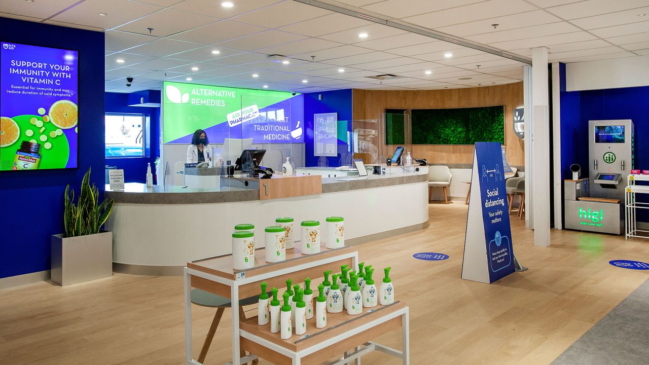 Rite Aid is moving the pharmacy counter to the center of its new store.