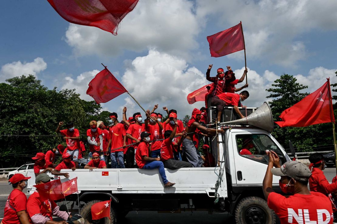 Supporters of the National League for Democracy (NLD) party take part in an election campaign rally on the outskirts of Yangon on October 25.