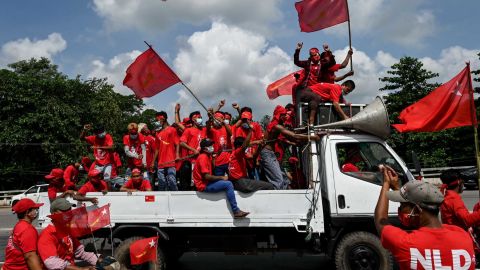 Supporters of the National League for Democracy (NLD) party take part in an election campaign rally on the outskirts of Yangon on October 25.