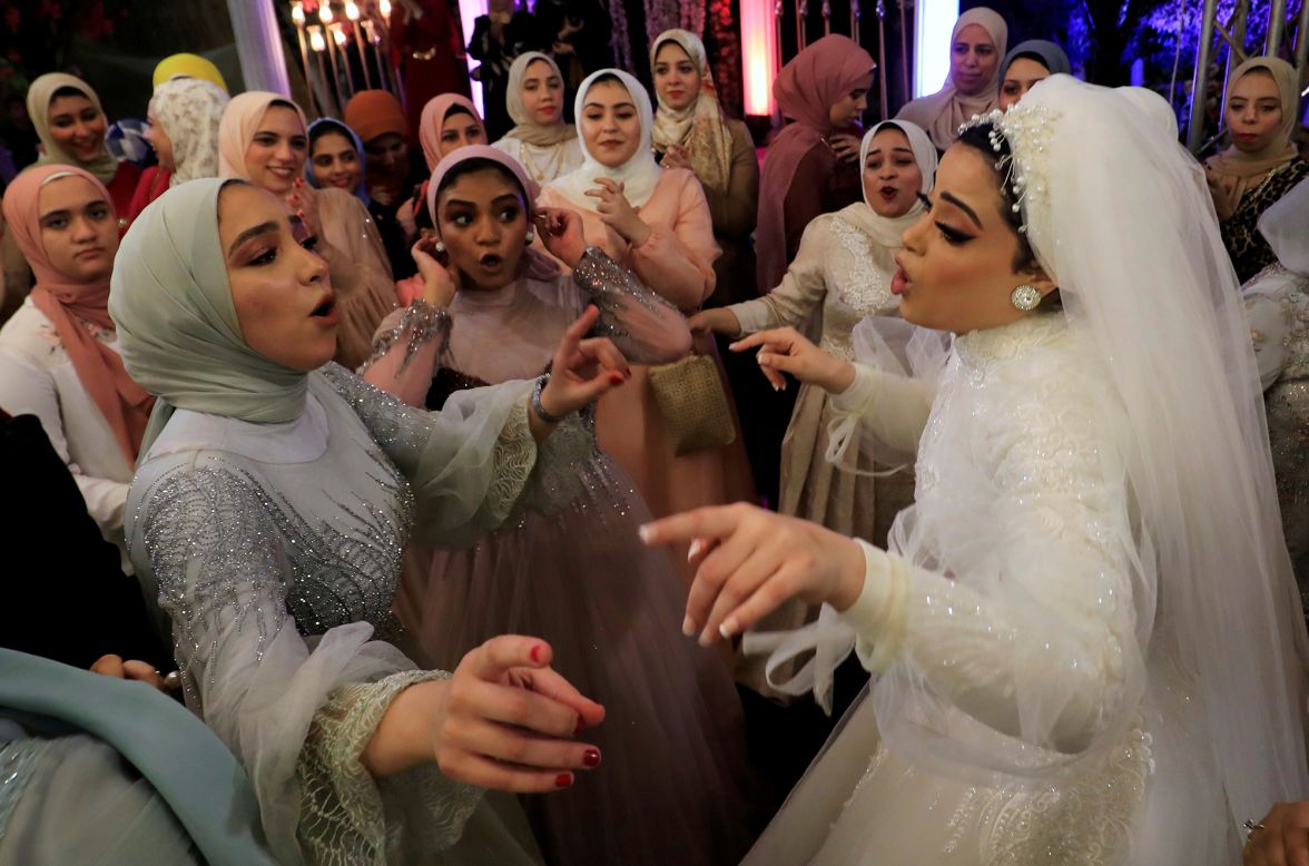Bride Hager Yasser dances with guests during her wedding celebration in Queisna, Egypt, on Wednesday, November 4.