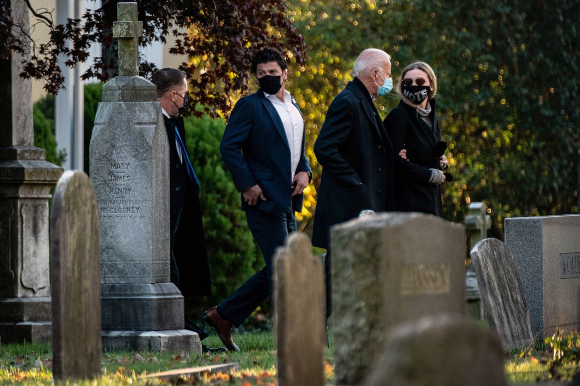 Democratic presidential nominee Joe Biden, walking arm in arm with his granddaughter Finnegan, visits the grave of his son Beau early on Election Day, Tuesday, November 3.