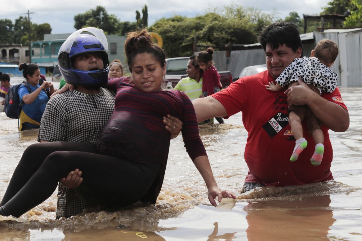 A pregnant woman is carried out of a flooded area in Planeta, Honduras, on Thursday, November 5. More than 2,000 people evacuated their homes in Honduras because of <a href="https://www.cnn.com/2020/11/04/weather/hurricane-eta-wednesday/index.html" target="_blank">Hurricane Eta</a>, according to the country's Permanent Contingency Commission.