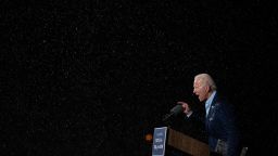 TOPSHOT - Former vice-president and Democratic presidential nominee Joe Biden delivers remarks in the rain during a Drive-In event in Tampa, Florida, on October 29, 2020. (Photo by Jim Watson/AFP/Getty Images)